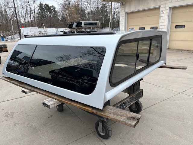 Silver truck cap with tinted windows for Nissan Titan 78.7" bed.