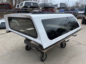 White truck cap with tinted windows for F150 pickup truck.