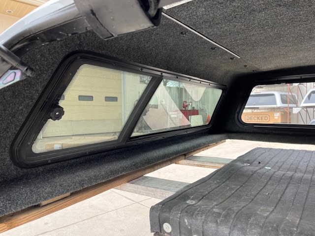 Custom truck bed storage solution with window for F150.