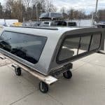Gray truck cap with tinted windows for GMC 1500, 70-inch bed, model GMU N3309861.