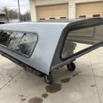Gray truck cap with tinted windows for Chevy 1500 8' bed.