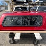 Red Ford Ranger 60-inch truck cap with tinted window for sale.