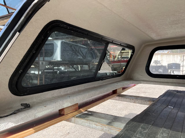 Ford Ranger 60" truck cap with tinted windows in Lucid Red color.