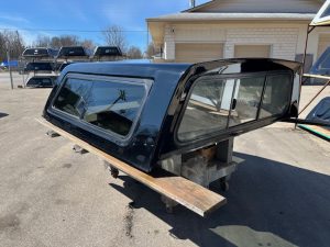 Black truck cap with tinted windows for Chevy 1500, 67" bed, GBA Black N4046094.