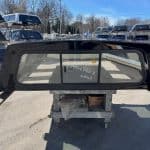 Black truck cap window for Chevy 1500 with tinted glass and aerodynamic design.
