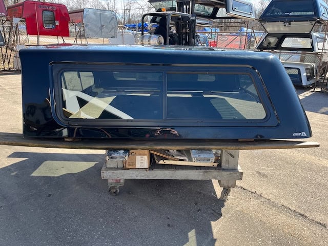 Black truck cap with tinted window for Chevy 1500.