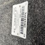 VIN plate on RAM 1500 truck with serial and model details.