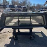 Gray truck cap with tinted windows for RAM 1500 76" body.