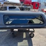Gray truck cap with tinted window for RAM 1500 76" bed.