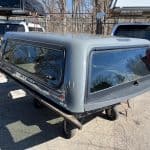 Gray truck cap with tinted windows for RAM 1500, 76" body, ceramic gray color.