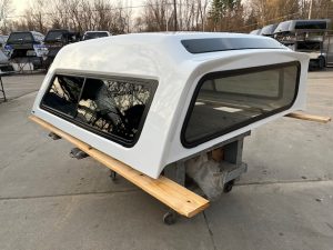 Summit white truck cap with tinted windows for Chevy HD 14-19 models.