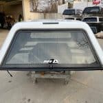 Summit White truck bed cap for Chevy HD 14-19 models with rear window and black trim.