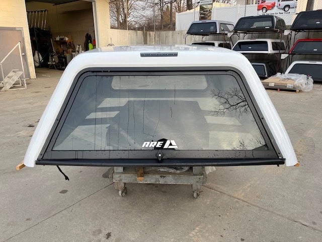 Summit White truck bed cap for Chevy HD 14-19 models with rear window and black trim.