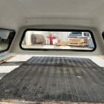 View of truck bed with tonneau cover in a Chevrolet HD pickup.