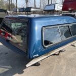 Northsky blue truck cap for Chevy 1500 with side windows and aerodynamic design.