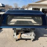 Northsky blue truck cap for Chevy 1500 with rear window and aerodynamic design.