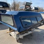 Northsky blue truck cap for Chevy 1500 with tinted windows and aerodynamic design.