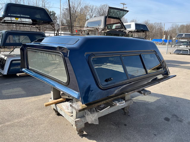 Northsky blue truck cap for Chevy 1500 with tinted windows and aerodynamic design.
