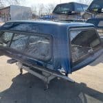 Northsky Blue truck cap for Chevy 1500 with tinted windows and aerodynamic design.