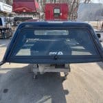 Northsky blue truck cap for Chevy 1500 with rear window and side panels.