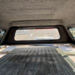 Interior view of Chevy 1500 truck with Northsky Blue cap and cargo area.
