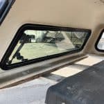 GMC 1500 truck cap with side window for pickup truck.