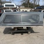 Gray truck bed cap for RAM 1500 with new body style and 76" length.