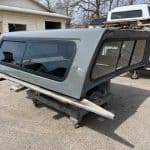 Gray truck cap with tinted windows for RAM 1500, new body style, ceramic gray color.