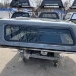 Gray truck bed cap for RAM 1500 in ceramic gray color.
