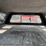Truck bed cover with a ceramic gray finish for RAM 1500.