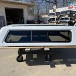 Summit white truck cap for Chevy HD 98" with tinted windows.