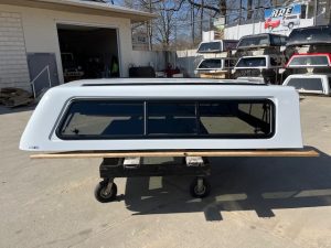Summit white truck cap for Chevy HD 98" with tinted windows.
