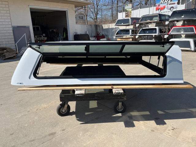 Summit white truck cap for Chevy HD 98" with tinted window and aerodynamic design.