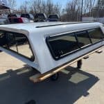 Summit white truck cap for Chevy HD 98" with tinted windows.