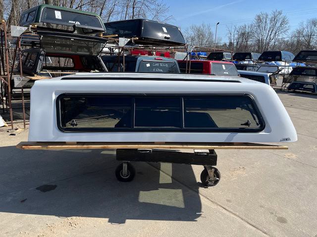 Summit white camper shell for Chevy HD 98" truck, outdoor storage solution.