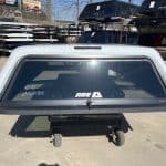 Summit white truck cap for Chevy HD 98" with window and mounting hardware.