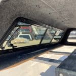 Interior view of a Chevy HD 98" truck bed with window and storage area.