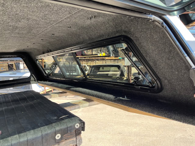 Side truck bed window on a Chevy HD in Summit White color.