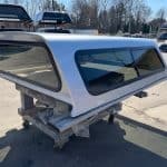 Silver truck cap with tinted windows for F150 9-14 model.