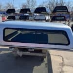 Silver truck cap with tinted window for F150 9-14 models.