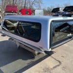 Silver truck cap with tinted windows for F150 79" bed, model N4523329.