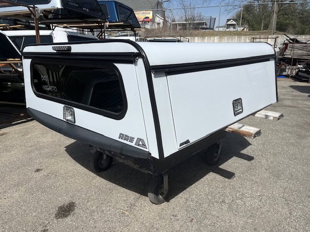 White truck bed cap with black accents for RAM 1500 67".