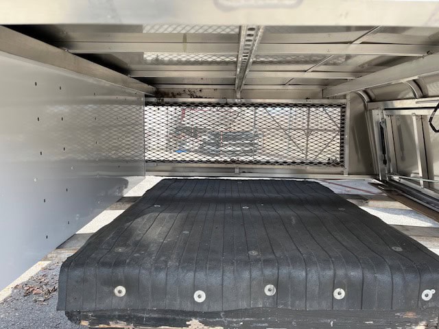 Durable truck bed cover with mesh barrier for 19+ RAM 1500.