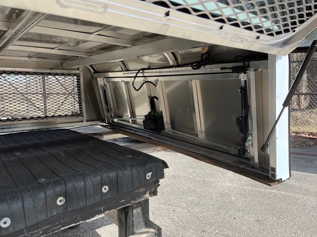 Durable truck bed storage solution for RAM 1500 67" with white color.