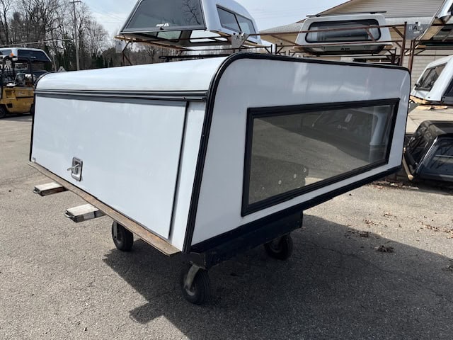 White camper shell with large window for Ford SD 81" truck bed.