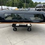 Black Chevy HD 98" truck bed side panel with window and wooden trim.