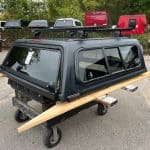 Matte black truck cap with roof rack for Toyota Tacoma 5' bed.