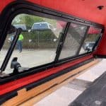 Red truck cap with large side window for Tacoma 5' truck bed.