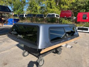 Satin Steel Gray truck cap with wooden side panel for Chevy 1500.