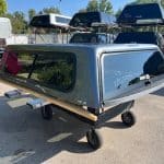 G9K Satin Steel Gray truck cap for Chevrolet 1500 with tinted windows.